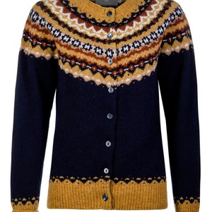 Front view of Navy blue Crathie fair isle cardigan showing mustard hem and cuffs and yoke pattern