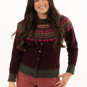 Model wearing burgundy wool Crathie fairisle cardigan