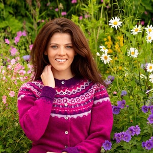 Model wearing bright fuchsia pink Crathie fair isle cardigan