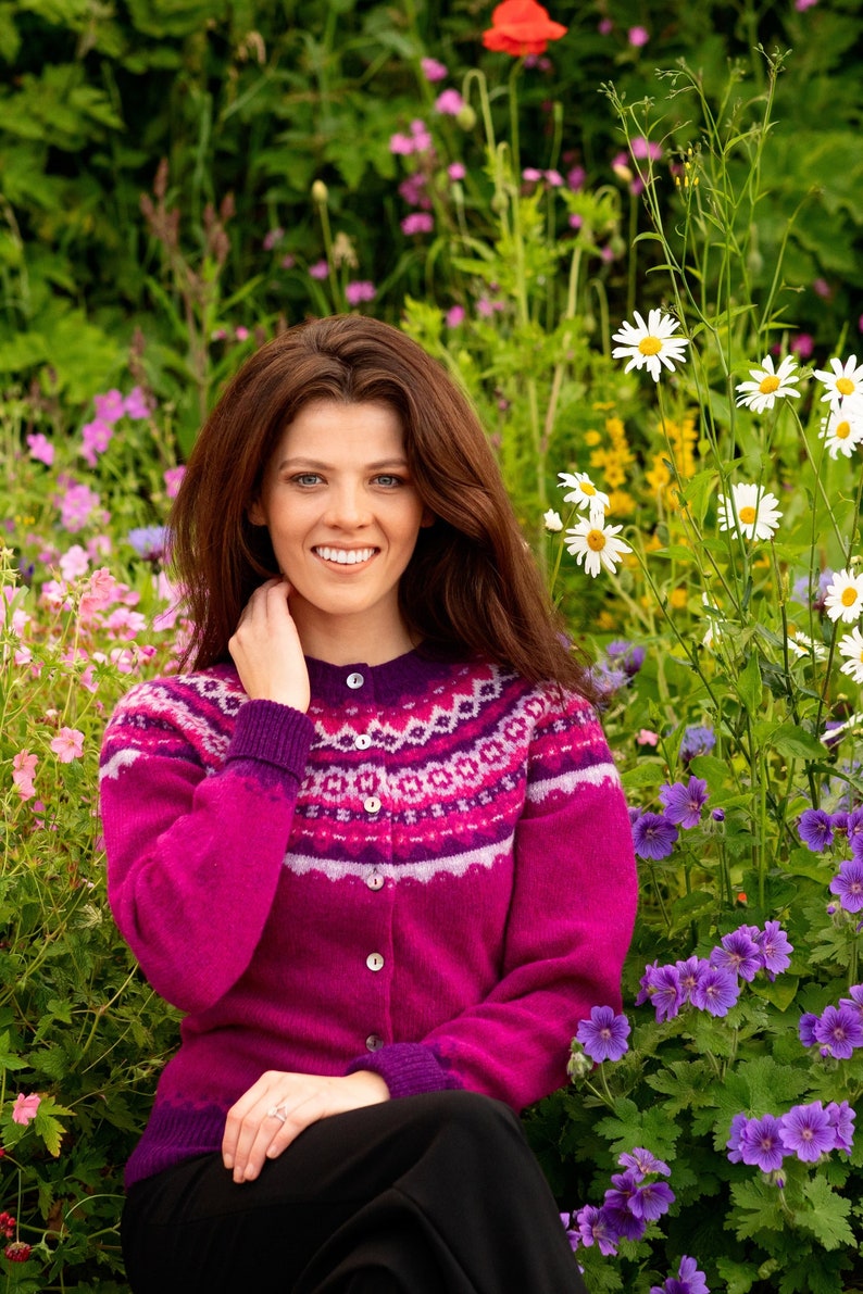 Model wearing bright fuchsia pink Crathie fair isle cardigan