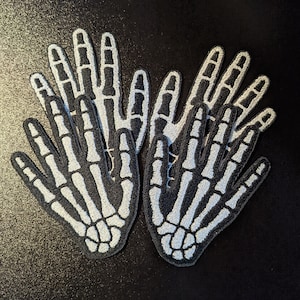 Geborduurde skelethanden opnaaiende patches