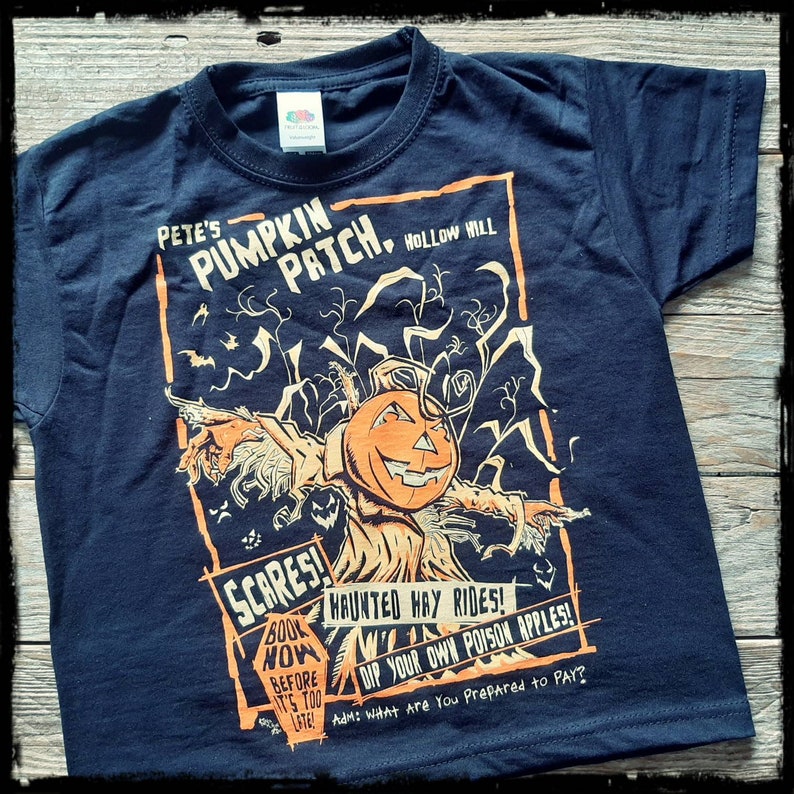 May include: Black t-shirt with a vintage-style illustration of a scarecrow with a pumpkin head. The text on the shirt reads "Pete's Pumpkin Patch. Hollow Hill. Scares! Book Now Before It's Too Late! Haunted Hay Rides! Dip Your Own Poison Apples! Adm: What Are You Prepared to Pay?"