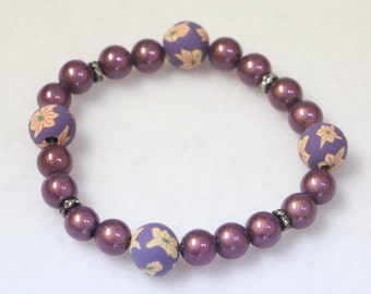 Glowing Purple bracelet./Rubberized Flower beads are Recycled Tires/ Handmade Jewellery/  Stretch Elastic Bracelet 7"         B-3156