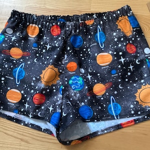 Med/Planets in outer space/Celestial theme on gray background flannel sleep shorts
