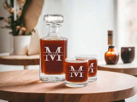 A hand-engraved personalized whiskey decanter set — the kind of gift that actually gets displayed on a bar cart rather than shoved in a drawer.