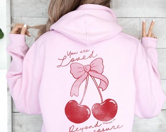 You are Loved Beyond Measure Jesus Apparel Streetwear Coquette Pink Feminine Cherry Ribbon Hooded Sweatshirt