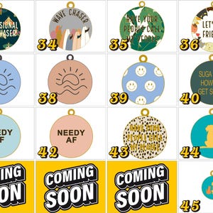 May include: A collection of circular metal pet ID tags featuring various designs including moths, surfboards, smiley faces, animal illustrations, and text phrases like Professional Bug Chaser, Wave Chaser, Let's Be Friends, Needy AF, and Coming Soon.