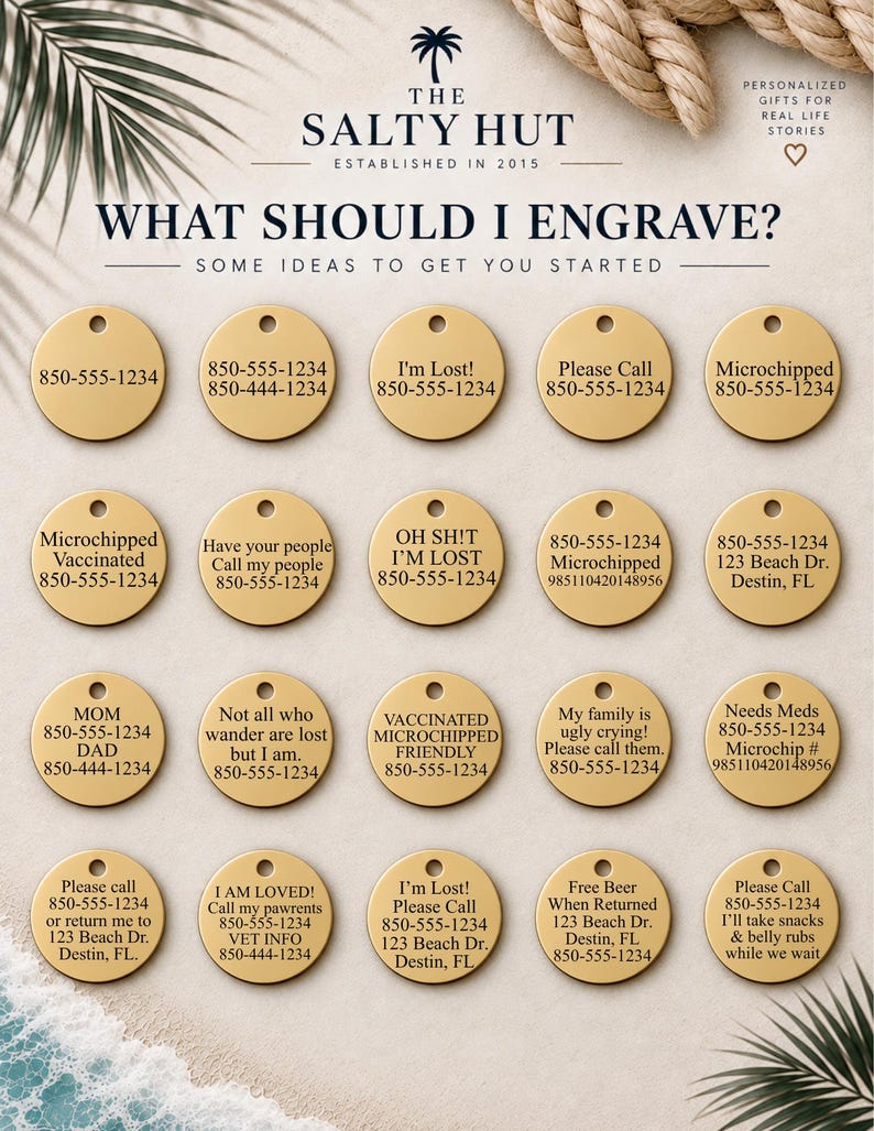 May include: A collection of twenty circular gold-toned metal pet identification tags arranged in four rows. Each tag features a small hole at the top and various engraved text examples including phone numbers, addresses, and phrases like I'm Lost.