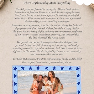May include: A rectangular photo frame with a distressed light blue finish and dark blue stars along the border. The frame contains a photograph of a family of five on a beach. Above the frame is text detailing the history of The Salty Hut.