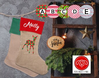 May include: A personalized Christmas stocking with a green and red top and a burlap body. The stocking is decorated with a red and green plaid deer and the name "Molly". The stocking is hanging on a wooden ladder with a sign that says "Dear Santa".