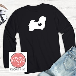 May include: Black long-sleeve t-shirt with a white silhouette of a Havanese dog with a heart on its chest. The shirt has the text "Personalize It Paws" on the bottom.