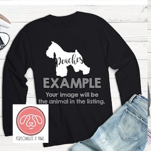 May include: Black long-sleeve shirt with a white silhouette of a dog and the text "Peaches" and "EXAMPLE". The text below the image says "Your image will be the animal in the listing."