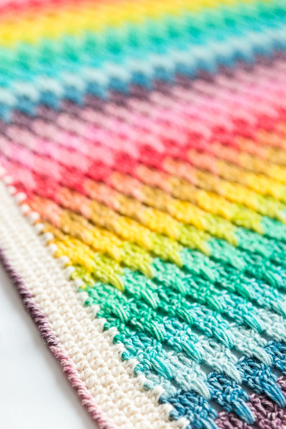 40 Rainbow Crochet Patterns to Brighten Home Decor, Gifts, and Everyday Accessories 7 Larksfoot Rainbow Crochet Blanket