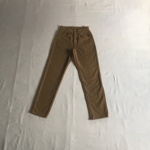 May include: A pair of brown corduroy pants.