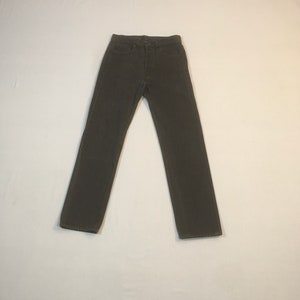 May include: A pair of dark brown denim jeans.