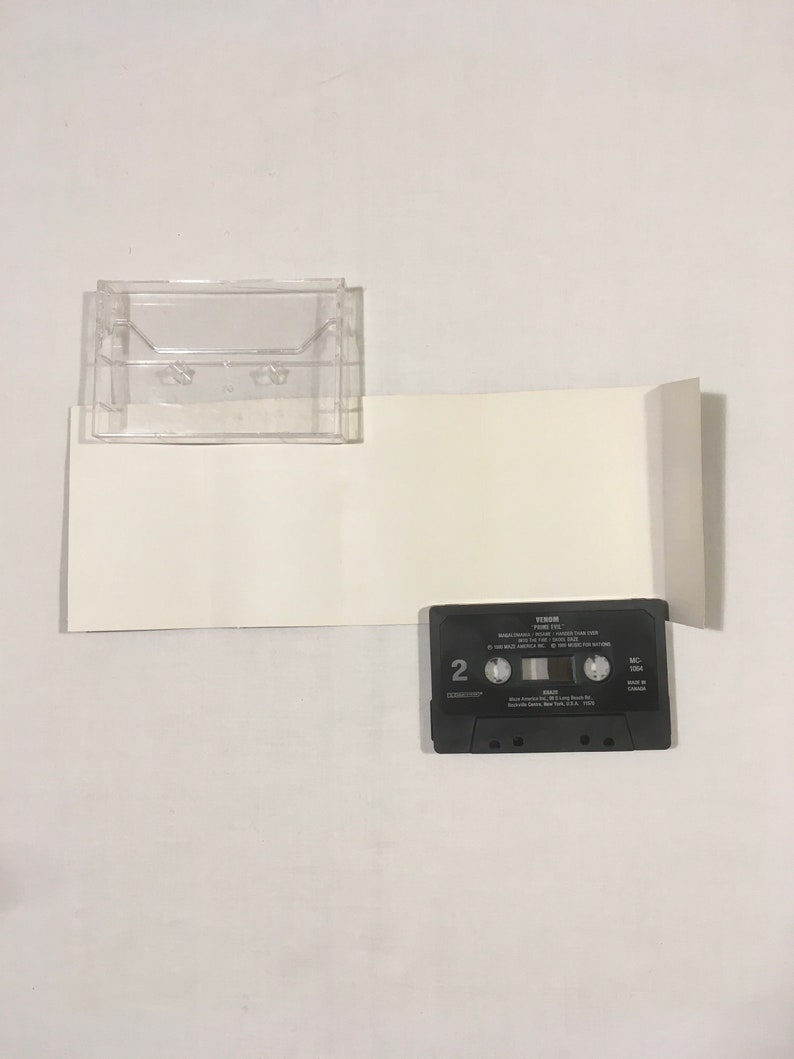 May include: A black cassette tape with the title "Tears In The Night" by "The Wake" printed on the label. The cassette tape is in a clear plastic case.