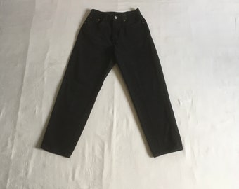 May include: A pair of dark brown denim jeans with a straight leg fit.