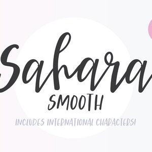 May include: A white circle with the word "Sahara Smooth" written in black cursive script. The text "Includes International Characters!" is written in a smaller font below the circle.