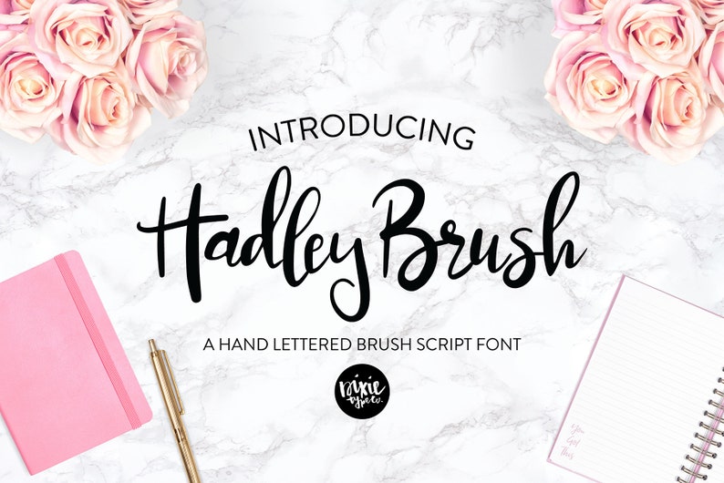 May include: Introducing Hadley Brush, a hand-lettered brush script font. The font is shown in black on a white marble background with pink roses and notebooks.