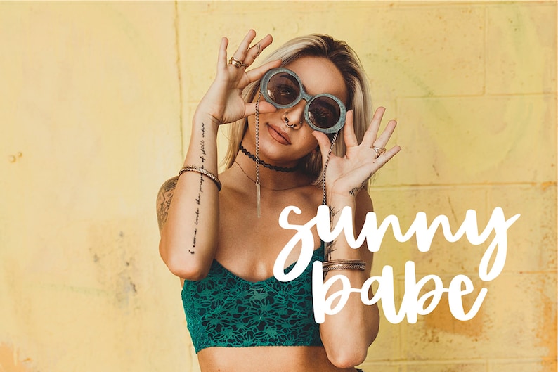 May include: A woman wearing round sunglasses, a green crop top, and several bracelets. The text "sunny babe" is written in white cursive letters on a yellow background.