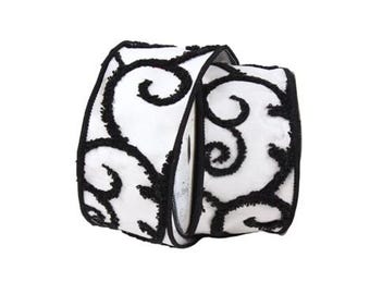 May include: White ribbon with black curly design. The ribbon is textured and has a fuzzy appearance.