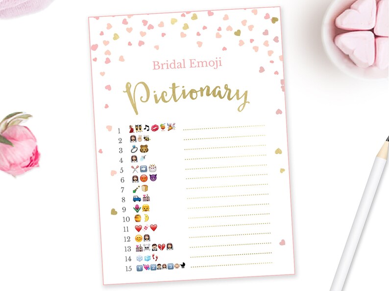 May include: A printable bridal shower game with a pink and gold color scheme. The game is called "Bridal Emoji Pictionary" and features a list of 15 emojis with blank lines for players to guess the corresponding words.