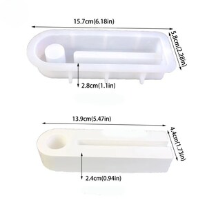 May include: Two white silicone molds for making resin crafts. The larger mold is 6.18 inches long, 2.28 inches wide, and 1.1 inches tall. The smaller mold is 5.47 inches long, 1.73 inches wide, and 0.94 inches tall.