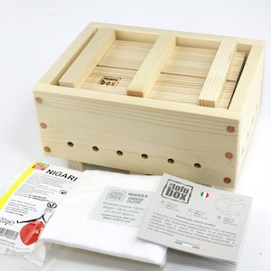 May include: A wooden tofu press with a removable top and a cloth for pressing tofu. The set includes a bag of nigari, a cloth, and instructions.