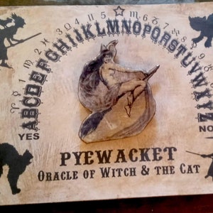 Halloween Pyewacket Witch Fortune Teller Ouija Board W/ 3D Resin Spinning Pointer Style Planchette Affixed To The Board Cosmo Bryant Designs