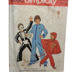 May include: A vintage Simplicity sewing pattern for boys' Halloween costumes. The pattern includes three costumes: a skeleton, an astronaut, and a devil. The pattern is for sizes 10-12 and includes transfers for appliques. The pattern is titled "6696 Simplicity" and is priced at $1.25.