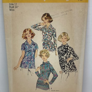 May include: A vintage sewing pattern for a women's blouse. The pattern is for size 12, bust 34 inches. The pattern includes four different styles of blouses, all with a paisley print. The pattern is from Simplicity and is number 5359.