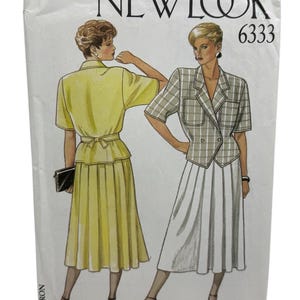 May include: A vintage New Look 6333 sewing pattern featuring illustrations of two women in short-sleeved suit ensembles. One suit is yellow, the other is a gray plaid. The pattern is for a skirt and jacket.