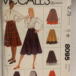 May include: McCall's sewing pattern for skirts. The pattern features illustrations of various skirt styles, including a plaid skirt, a button-down skirt, and a tiered skirt. The pattern includes the McCall's logo and the number 8095. The size is 8, waist 24.