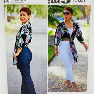 May include: A sewing pattern for a wrap top with a floral print. The pattern is from Simplicity and is designed by Mimi G. The pattern number is R11396 and the size is US 6-14, EU 32-40, FR 34-42.