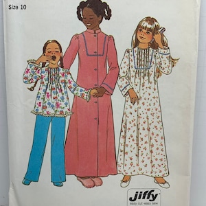 May include: Simplicity sewing pattern number 7731 for girls' nightgowns. The pattern includes three different styles: a long-sleeved nightgown with a floral print, a long-sleeved nightgown with a solid color, and a short-sleeved nightgown with a floral print. The pattern is for sizes 10.