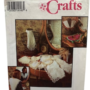 May include: Simplicity Crafts pattern number 8465, one size, for a lace collar. The pattern shows a woman wearing a white lace collar, and a close-up of the collar on a table.
