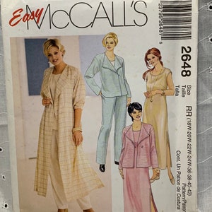 May include: A sewing pattern for a long, open-front jacket with a plaid design. The pattern includes three different views of the jacket, each with a different color and style. The pattern is for sizes 18W-20W-22W-24W-36-38-40-42. The pattern is called "Easy McCall's" and the pattern number is 2648.