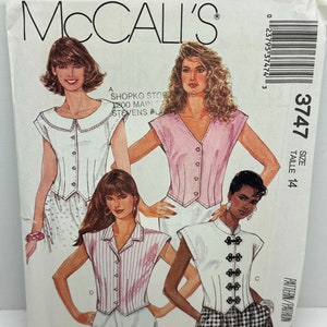 May include: A sewing pattern for four different tops. The pattern is from McCall's and is size 14. The tops are all sleeveless and have a button-up front. The first top is white with a Peter Pan collar. The second top is pink with a V-neck. The third top is striped and has a collar. The fourth top is white with a mandarin collar and decorative buttons.