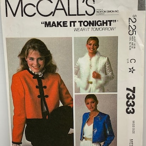May include: A vintage McCall's sewing pattern for a jacket. The pattern is for a miss size medium and is titled "Make It Tonight" and "Wear It Tomorrow". The pattern shows three different styles of jackets, one in red, one in white, and one in blue.