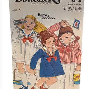 May include: A vintage sewing pattern for children's clothing by Butterick, featuring a design by Betsey Johnson. The pattern is for size 4 and includes three different styles of sailor-themed dresses.