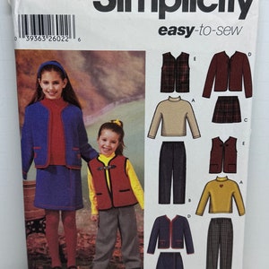May include: Simplicity sewing pattern number 5942, size K5 7, 8, 10, 12, 14, easy-to-sew, with instructions for making a girl's vest, pants, skirt, and sweater. The pattern includes a photo of two girls wearing the finished garments.