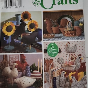 May include: A Simplicity Crafts sewing pattern featuring a collection of whimsical farmhouse-style decor projects. The pattern includes instructions for making a variety of items, including sunflowers, chickens, and ducks. The pattern is by Elaine Heigl and is titled "By Elaine Heigl".