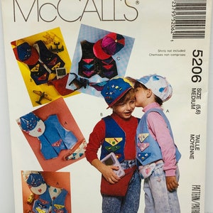 May include: A sewing pattern for a vest and hat for children. The pattern is for sizes 5 and 6. The pattern is from McCall's and is called "Jean Walls".