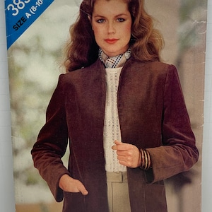 May include: A brown corduroy jacket with a mandarin collar and a single pocket on each side. The jacket is closed with a zipper. The pattern number is 3836 and the size is A (8-10-12).