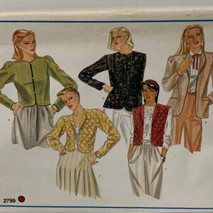 May include: A sewing pattern for four different jackets. The pattern is from Vogue's Basic Design and the pattern number is 2799.