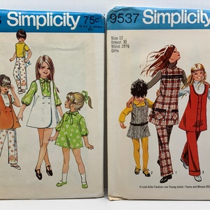 May include: Two vintage Simplicity sewing pattern envelopes with illustrations of girls wearing dresses and skirts. The pattern numbers are 8716 and 9537. The patterns are for sizes 12, with a bust measurement of 30 inches and a waist measurement of 25 1/2 inches.