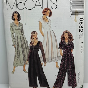 May include: A sewing pattern for three different styles of dresses. The pattern is for sizes 6, 8, and 10. The pattern is from McCall's and the pattern number is 6882.