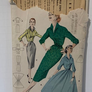 May include: A vintage sewing pattern for a dress and skirt. The pattern includes instructions for making a green dress with a collar and a blue skirt with a wide waistband. The pattern is labelled "Quick 'n Easy" and includes a "Not Exchangeable or Returnable" notice.