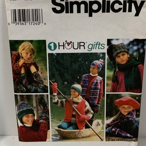 May include: Simplicity pattern 9781 for making children's winter clothing. The pattern includes instructions for making a hat, scarf, mittens, and a vest. The pattern is for sizes S, M, and L.