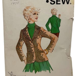 May include: Vintage Kwik Sew sewing pattern 500, sizes 8-10-12. The cover features an illustration of a woman in a tan and black checkered jacket, green turtleneck, and skirt. The pattern is from 1978 and includes the text "ORIGINALS" and "SEW".